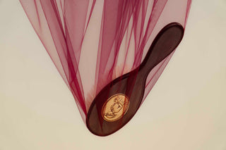 Altesse Studio Collector brushStudio in an artistic approach, revealing its pewter medallion, dark wood handle, and the finesse of ancestral handmade craftsmanship.